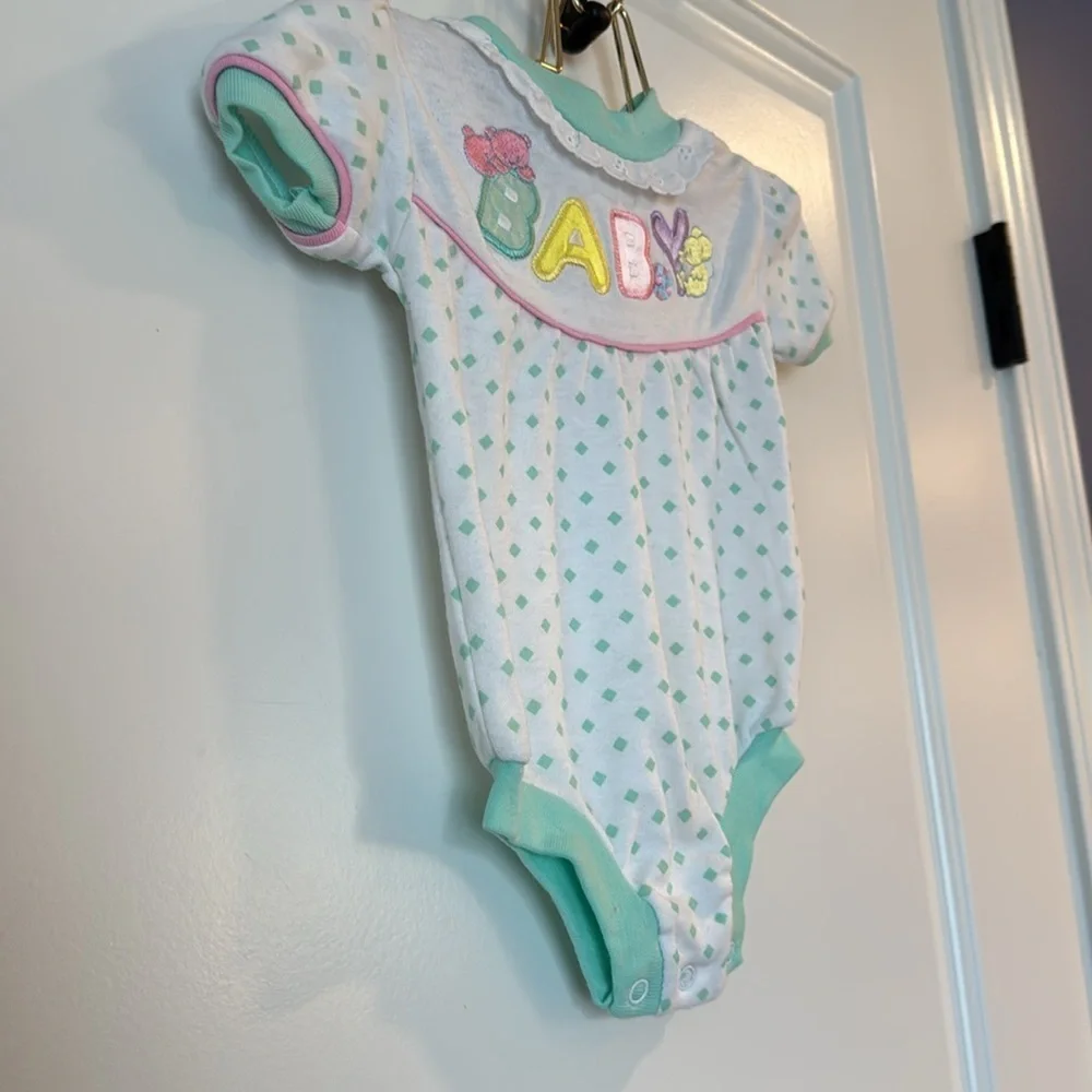 baby onesie w/ word BABY on front w/ pastel colors teal polka dot 6/9 months
